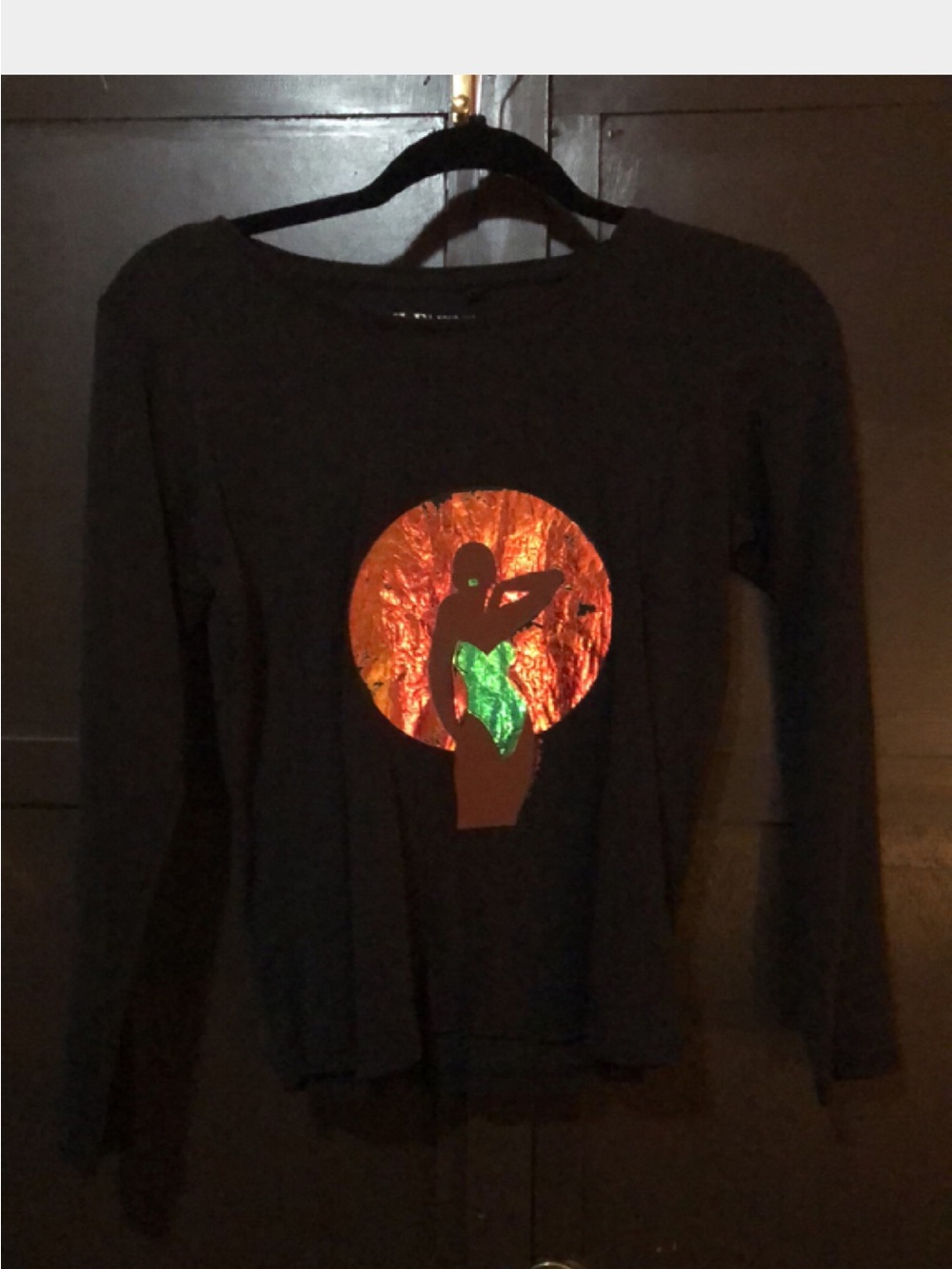 Women's Black Long-Sleeve Graphic Top with Metallic Art Accent
